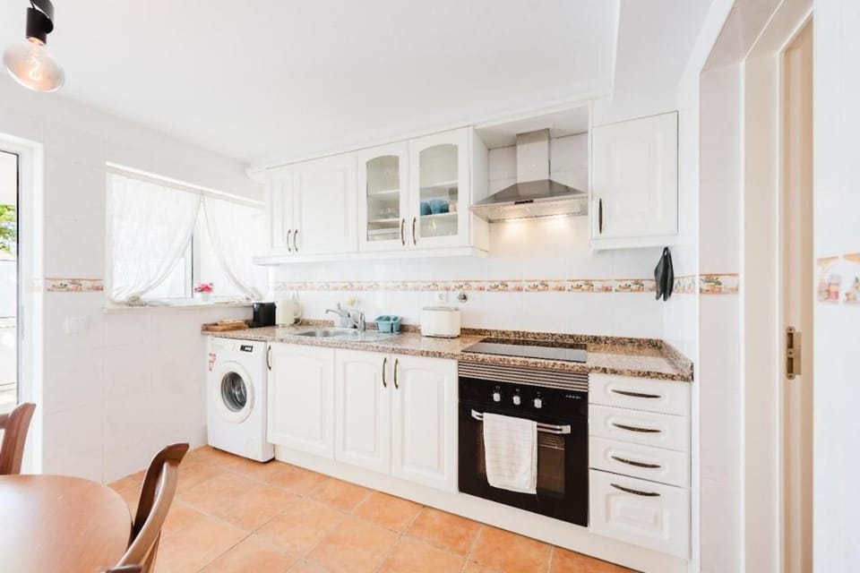 Kitchen or kitchenette, oven, stove, washing machine, kitchen