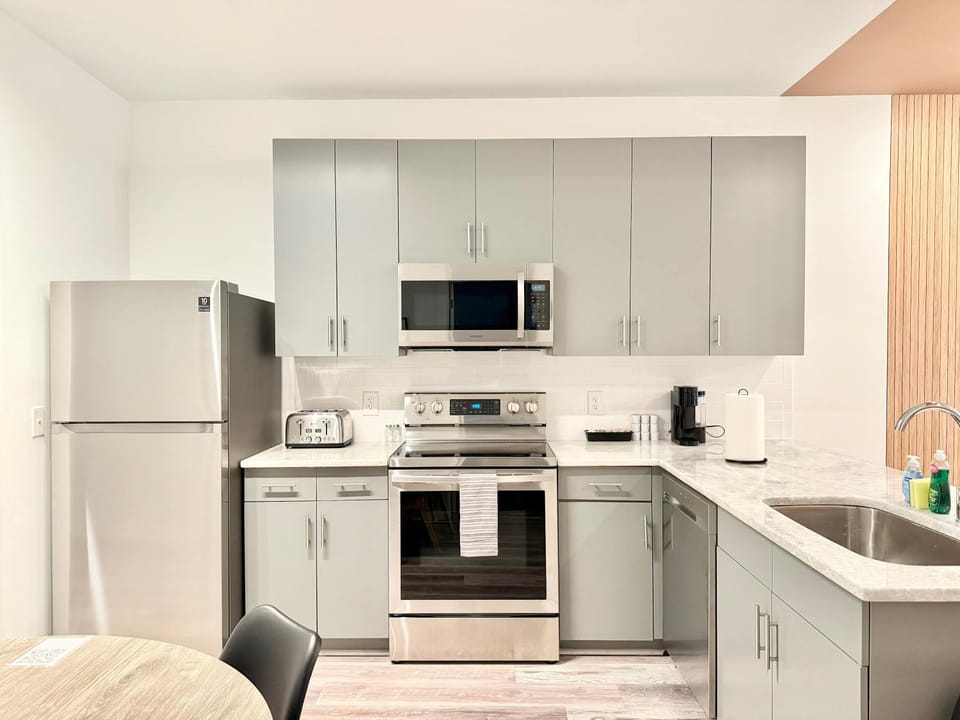 Kitchen or kitchenette, dishwasher, oven, stove, toaster