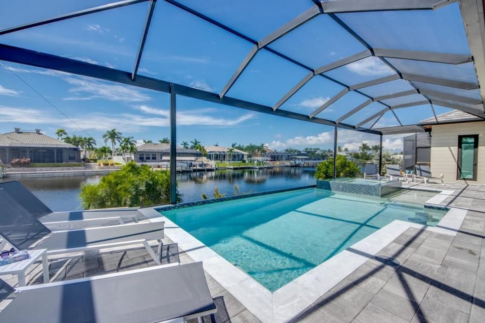 CoralVilla Twenty Two - modern, pool & spa, water view, boating, TV House in Cape Coral
