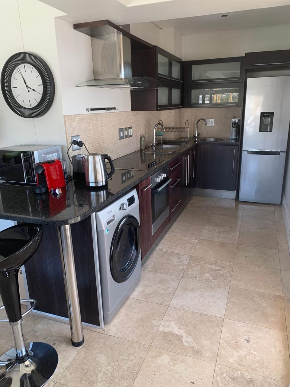 Kitchen or kitchenette, washing machine