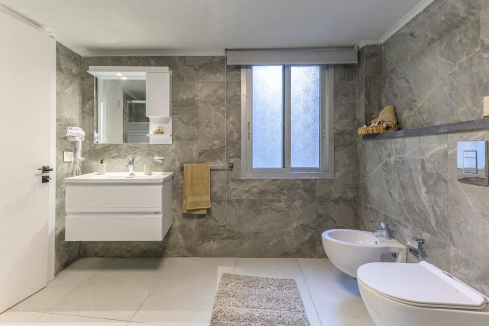 Toilet, Bathroom, bidet, hair dryier, towels