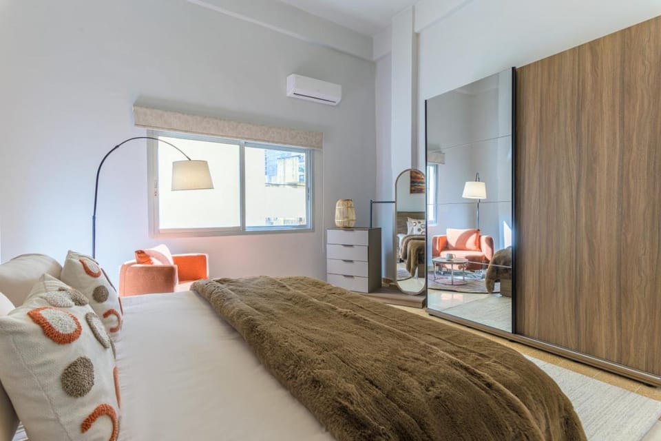 Bed, Seating area, Bedroom, City view, wardrobe, air conditioner