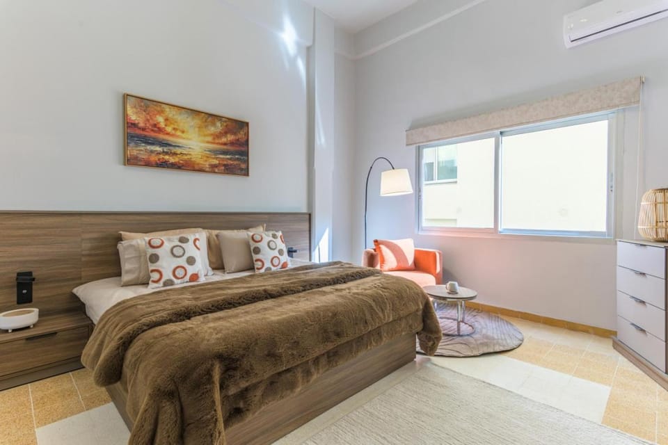 Bed, Seating area, Bedroom, City view, air conditioner