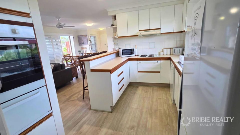Kitchen or kitchenette, dishwasher, oven, stove, toaster
