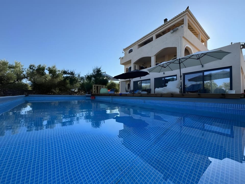 Property building, Living room, Swimming pool