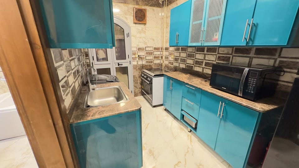 Kitchen or kitchenette, oven, stove, washing machine, washing machine