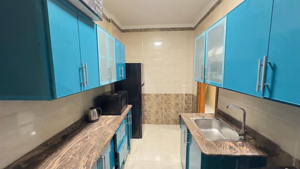 Coffee/tea facilities, Kitchen or kitchenette, furniture, microwave, oven, stove, washing machine