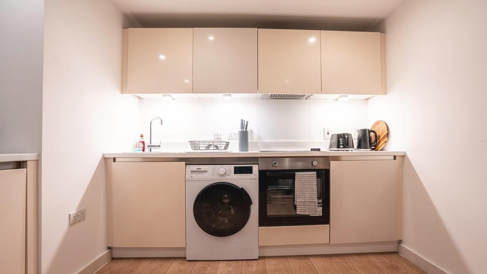 Kitchen or kitchenette, oven, stove, washing machine, dryer