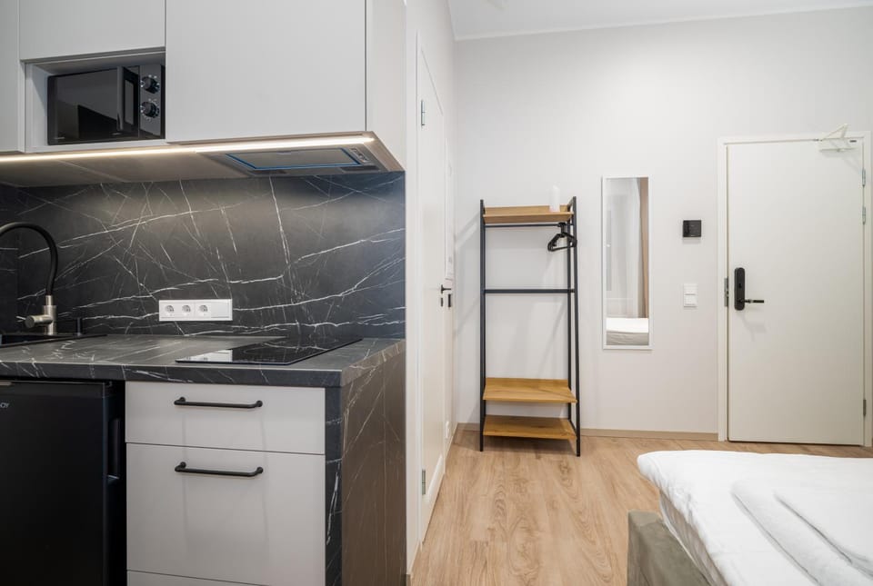Kitchen or kitchenette, microwave, minibar, stove, wardrobe
