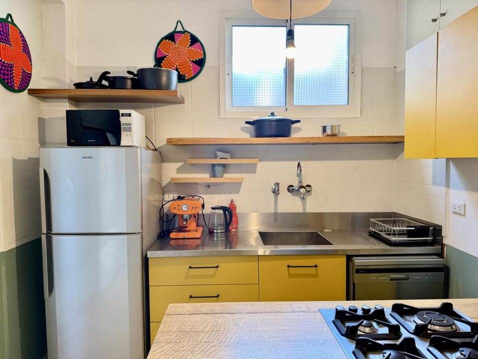 Kitchen or kitchenette, microwave, oven, stove