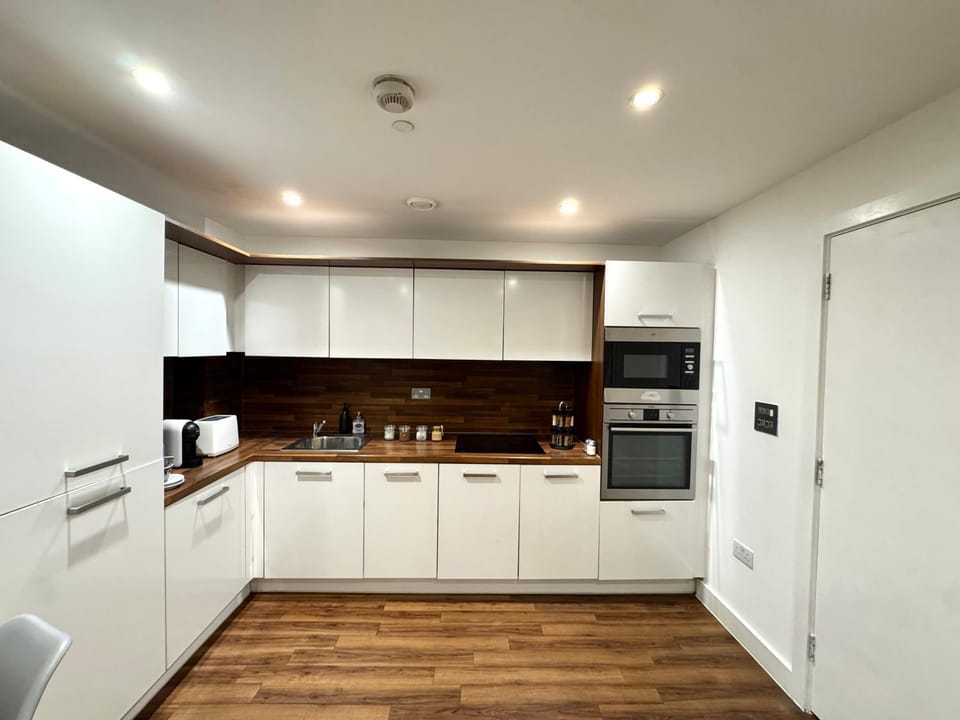 Kitchen or kitchenette, dishwasher, oven, stove, toaster