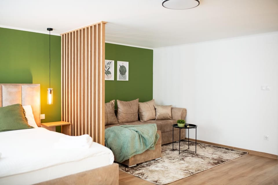 Bed, Living room, Seating area, Bedroom