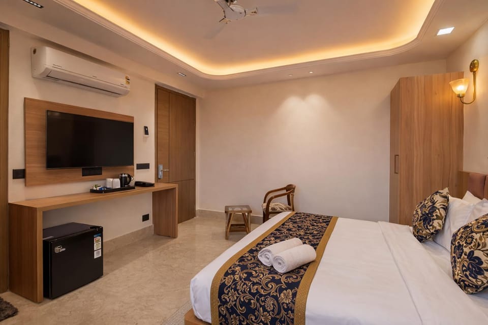 Communal lounge/ TV room, Bed, TV and multimedia, Kitchen or kitchenette, Living room, Photo of the whole room, Seating area, Evening entertainment, Bedroom, fireplace, hair dresser, minibar, towels, air conditioner