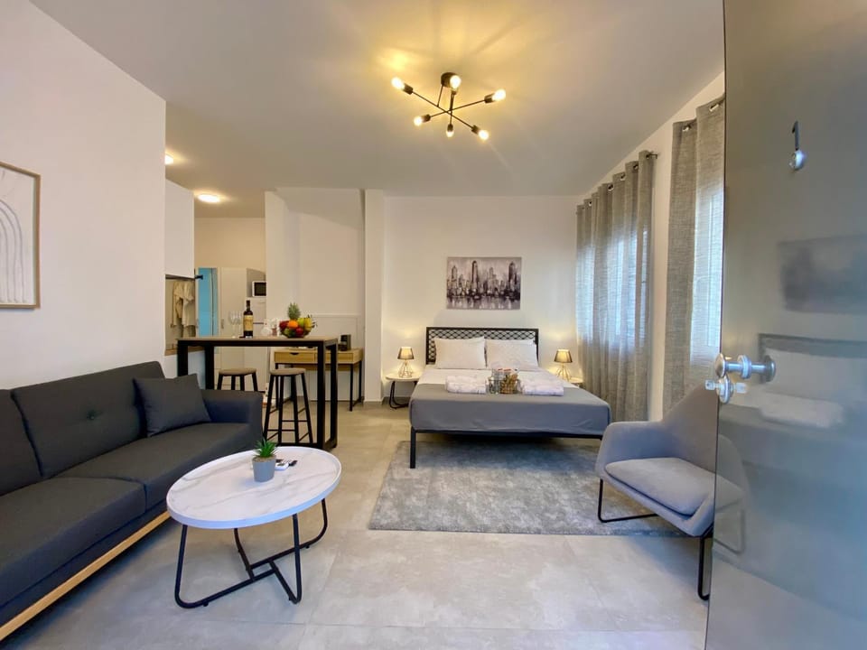 Bed, TV and multimedia, Living room, Seating area, Bedroom