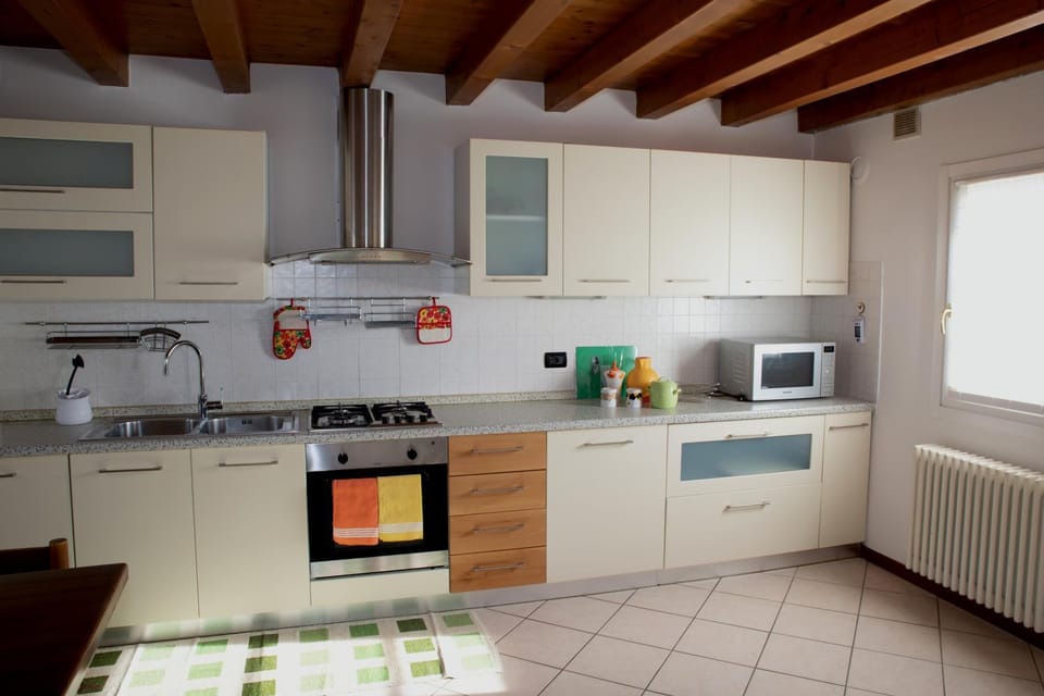 Kitchen or kitchenette, dishwasher, oven, stove