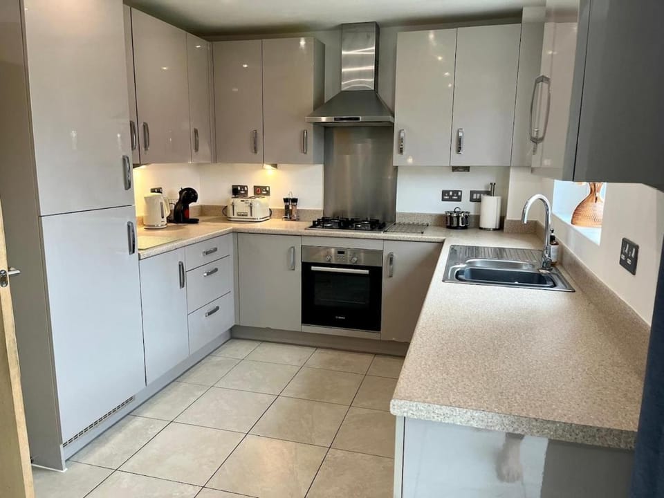 Kitchen or kitchenette, dishwasher, oven, stove, toaster