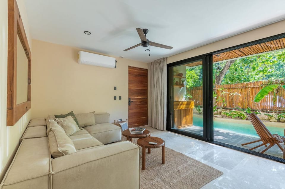 Living room, Seating area, Garden view, Pool view