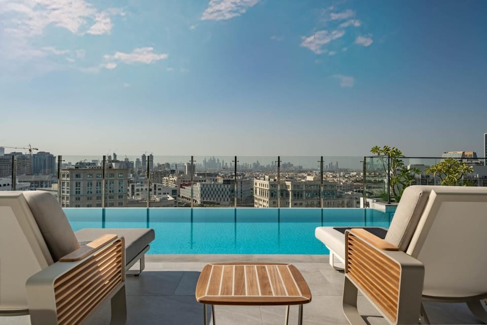 Sunlit Luxe Studio Serene Skies Infinity Pool Apartment in Dubai
