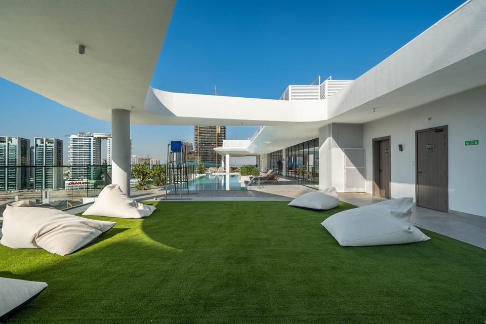 Sunlit Luxe Studio Serene Skies Infinity Pool Apartment in Dubai