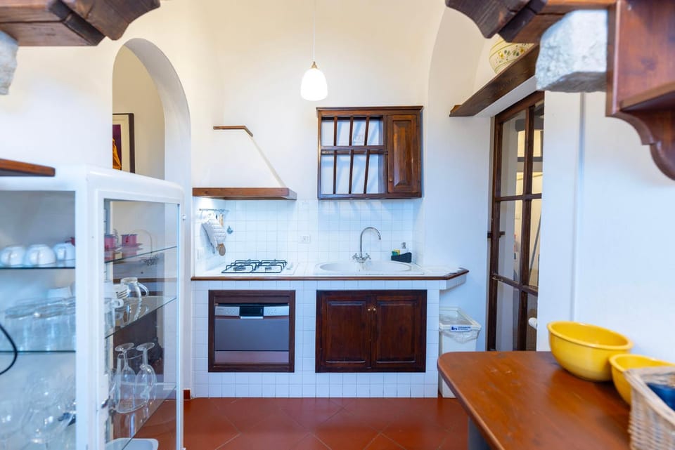 Kitchen or kitchenette, dishwasher, oven, stove