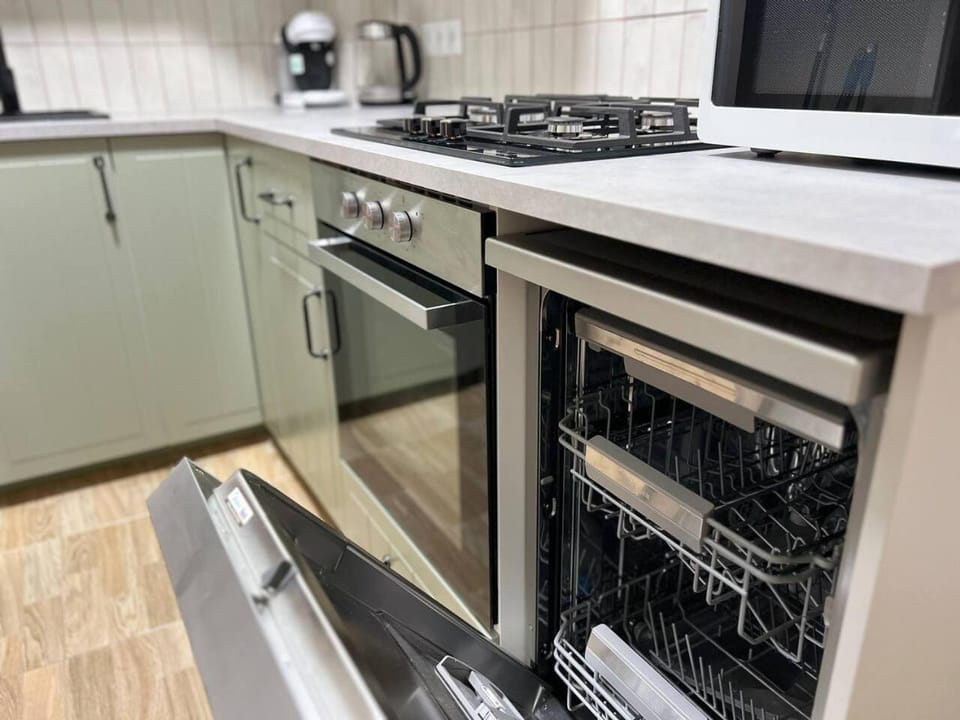Kitchen or kitchenette, dishwasher, oven, stove