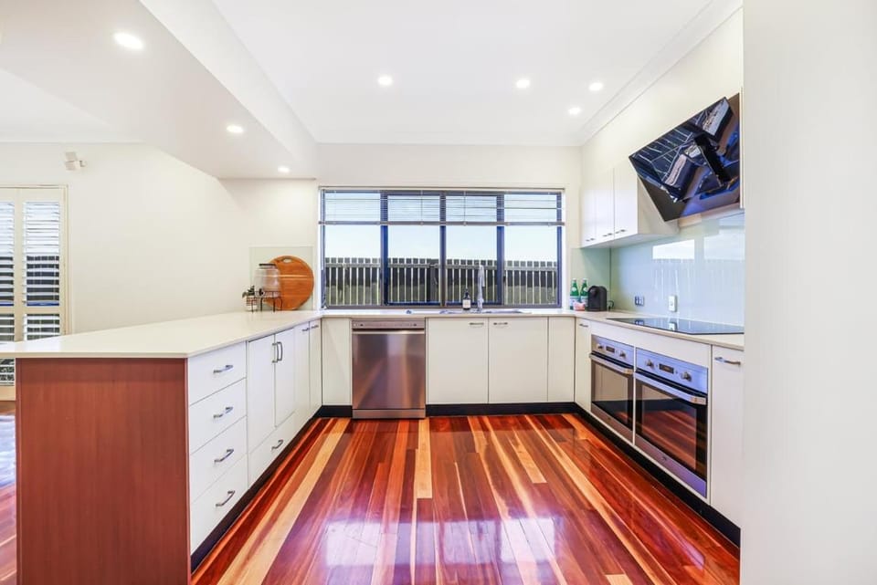 Kitchen or kitchenette, dishwasher, oven, stove