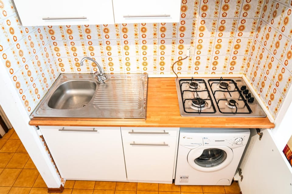 Kitchen or kitchenette, stove, washing machine
