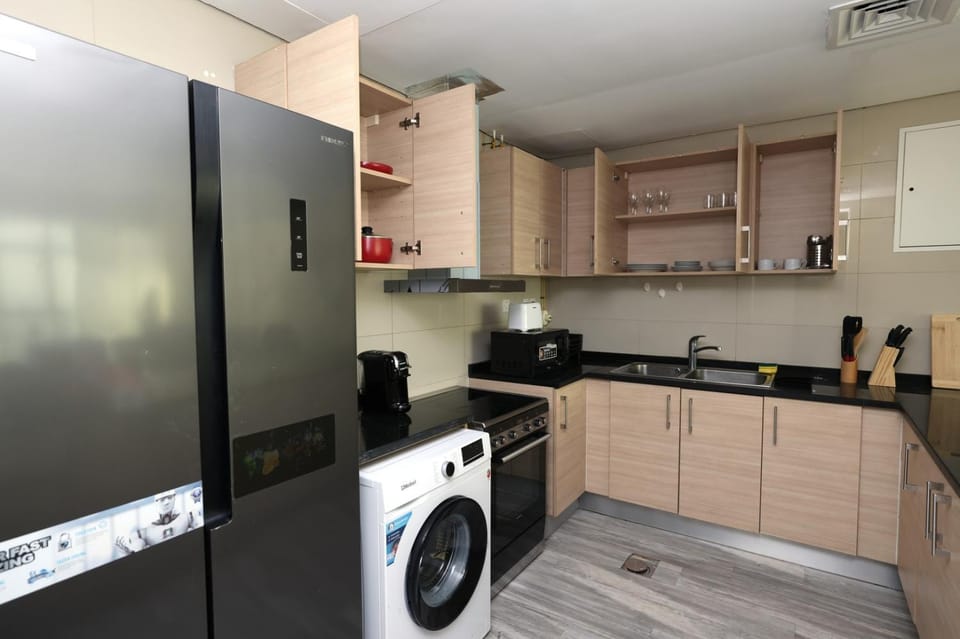 Coffee/tea facilities, Kitchen or kitchenette, oven, stove, toaster, washing machine