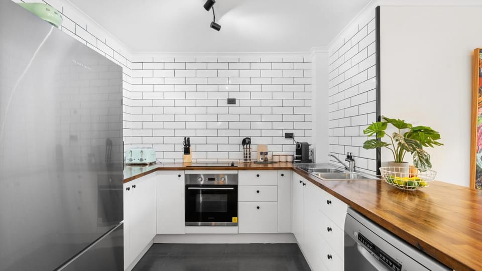 Kitchen or kitchenette, dishwasher, oven, stove, toaster