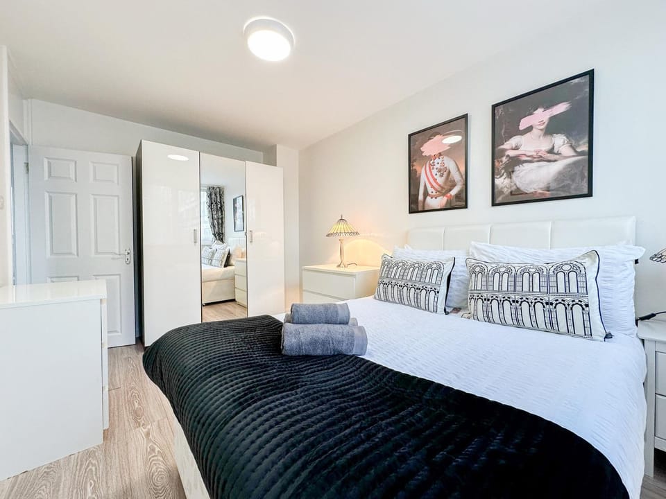 Bed, Photo of the whole room, Decorative detail, Bedroom, flat iron, hair dryier, storage, towels, wardrobe