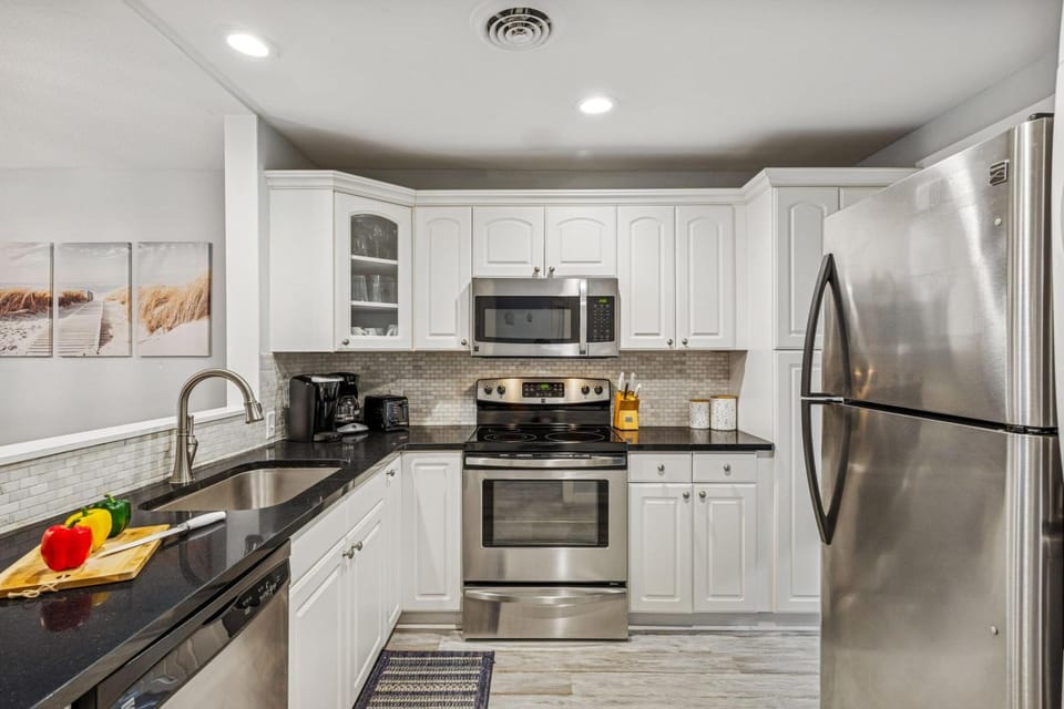 Kitchen or kitchenette, dishwasher, oven, stove, toaster