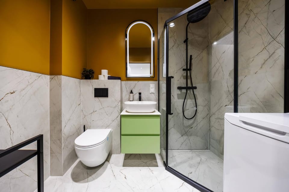 Shower, Bathroom, hair dryier, towels, washing machine
