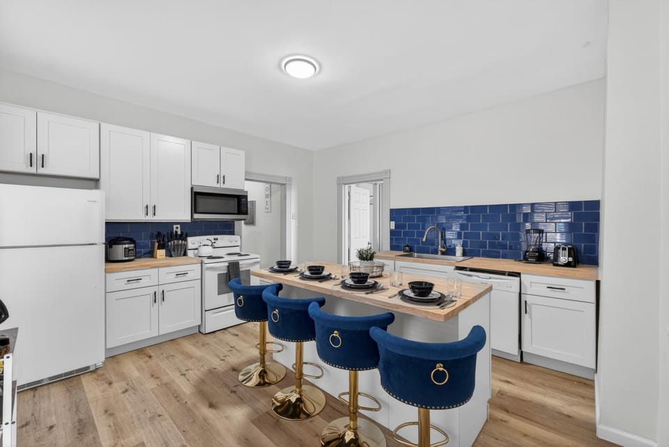 Kitchen or kitchenette, dishwasher, microwave, oven, stove, toaster