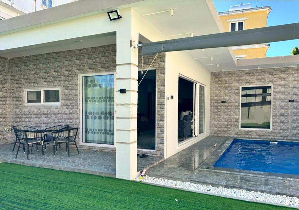 Property building, Patio, Day, Seating area, Pool view, Swimming pool
