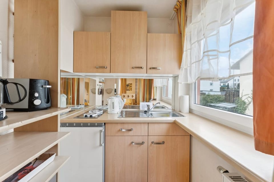 Kitchen or kitchenette, stove, toaster