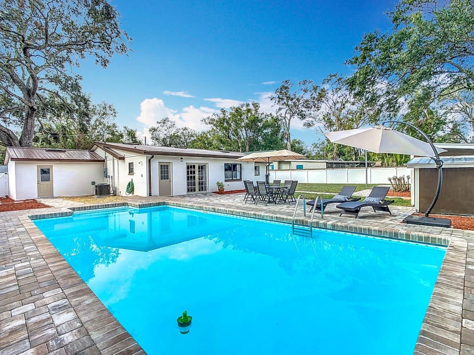 Property building, Patio, Pool view, Swimming pool, sunbed