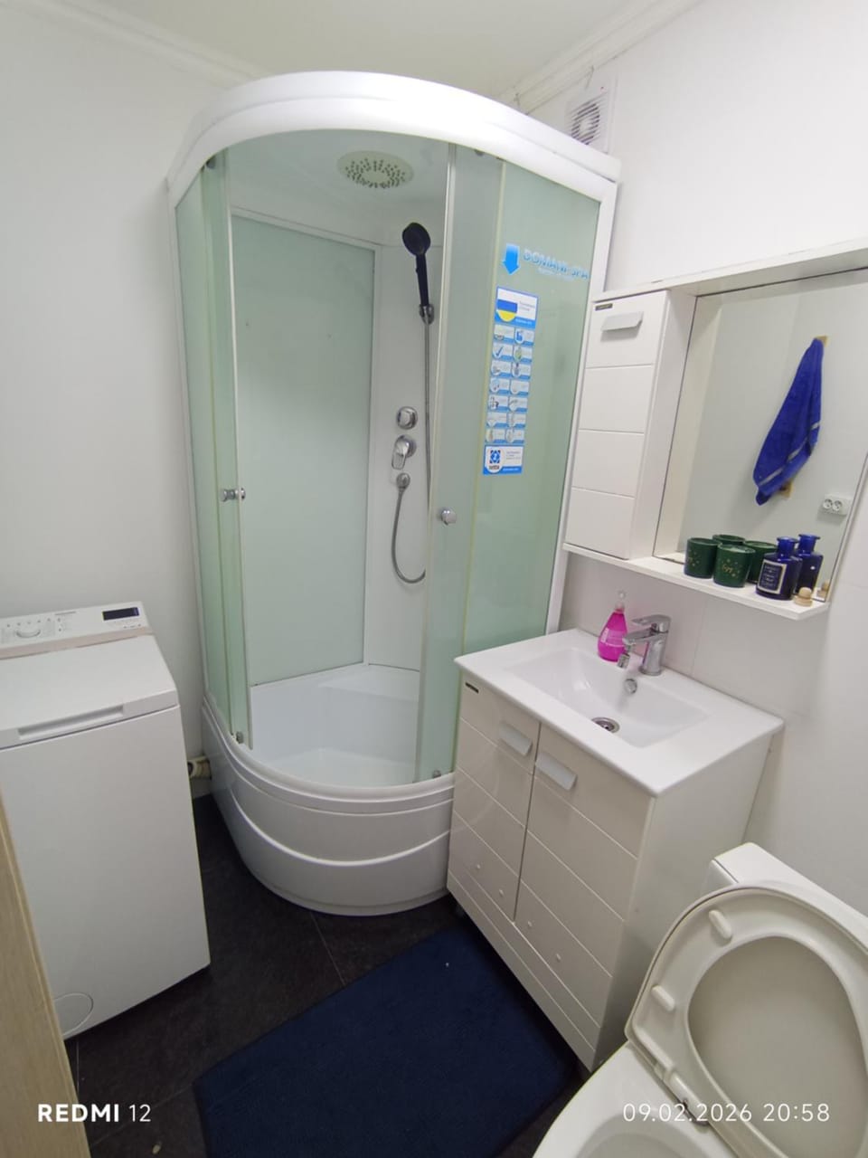 Shower, Toilet, towels, washing machine