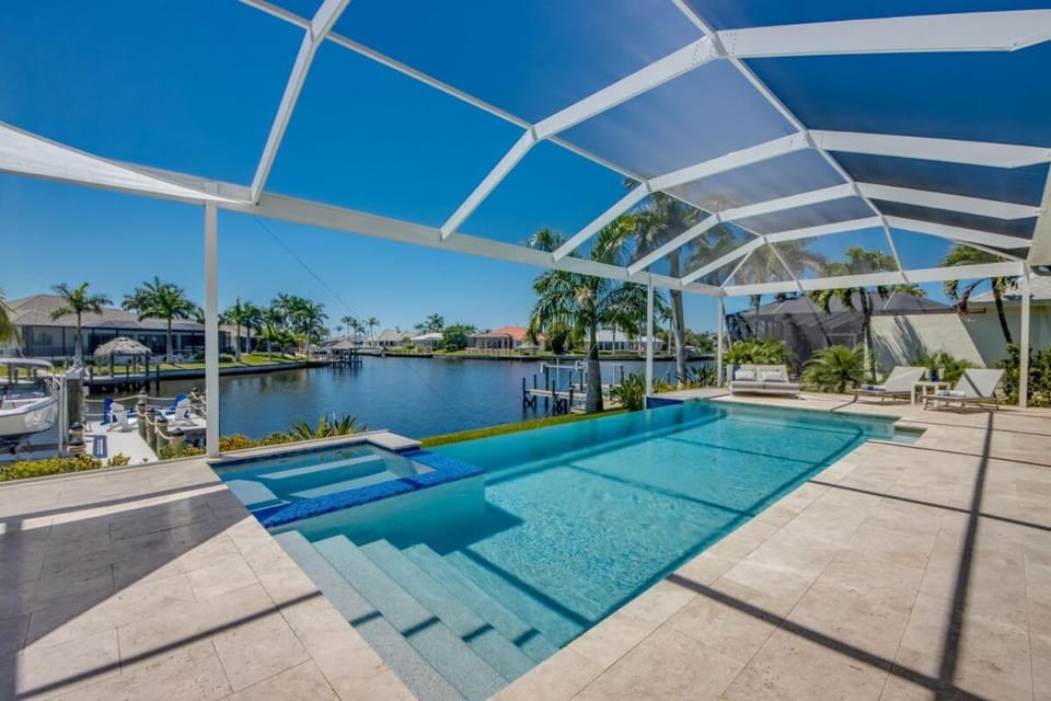 CoralVilla Sensation - great water view, infinity pool, fire place, gulf access Villa in Cape Coral