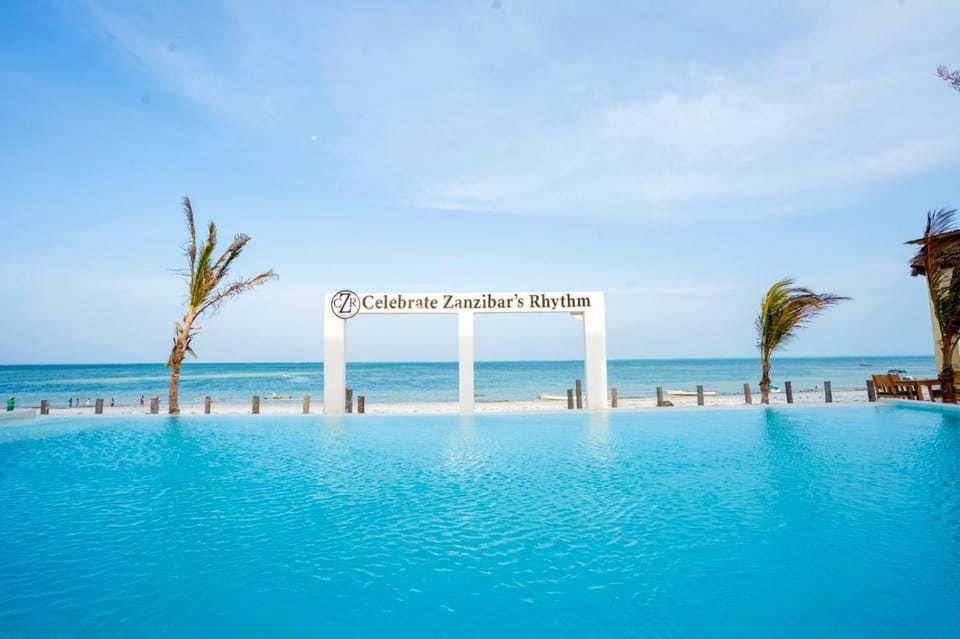 Day, Property logo or sign, Natural landscape, Beach, Logo/Certificate/Sign, Pool view, Sea view, Swimming pool, Swimming pool