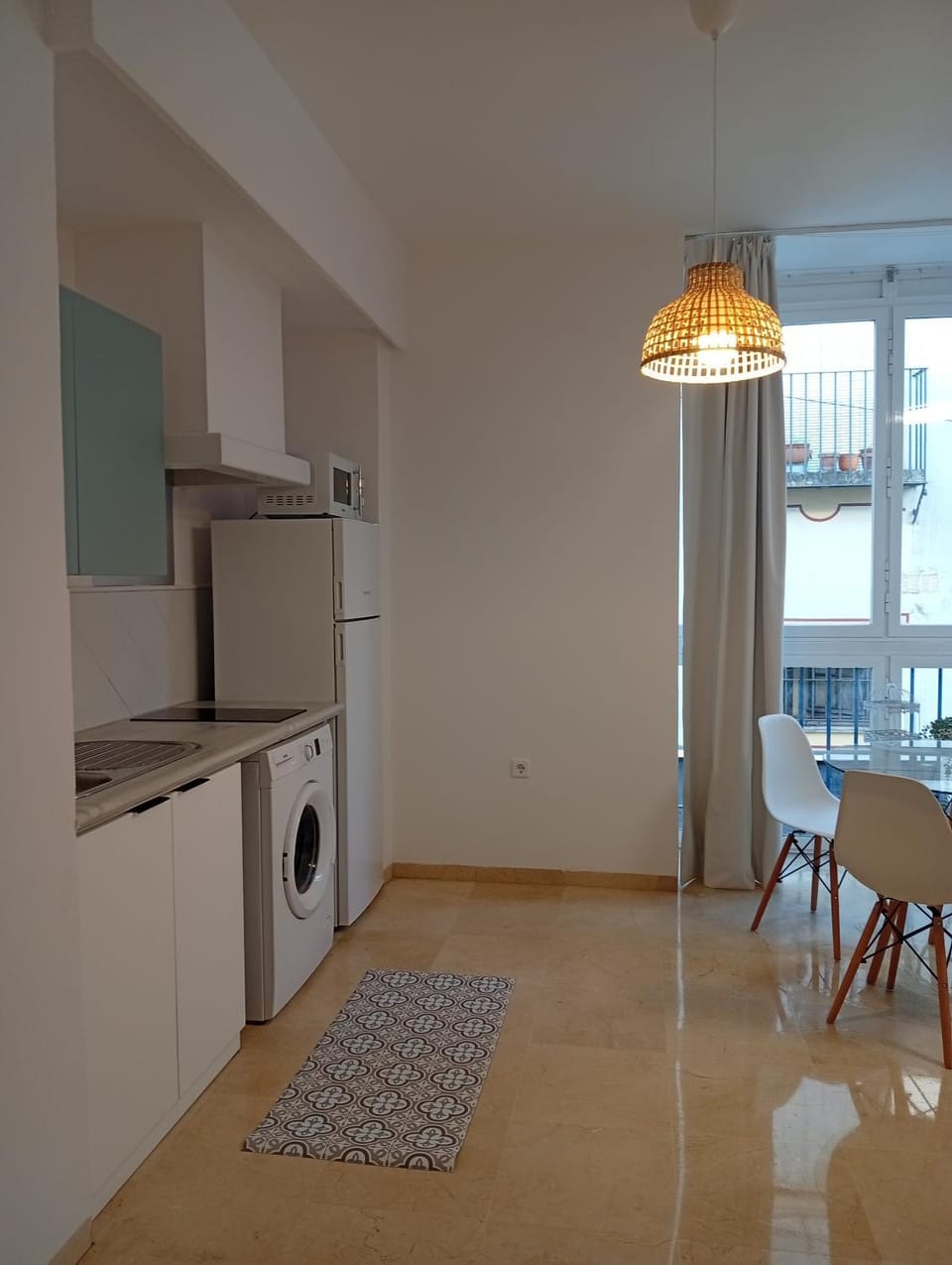 Dining area, microwave, washing machine, kitchen