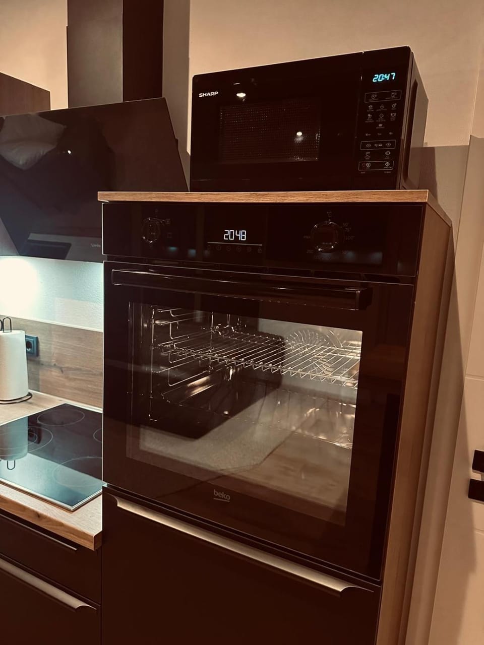 Kitchen or kitchenette, microwave, oven, stove