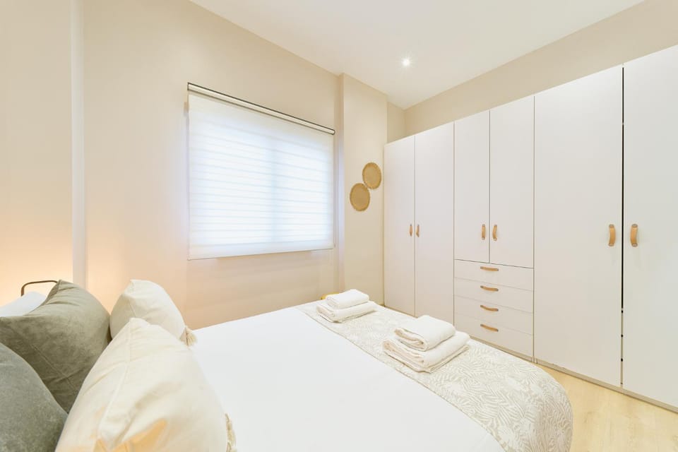 Bed, towels, wardrobe