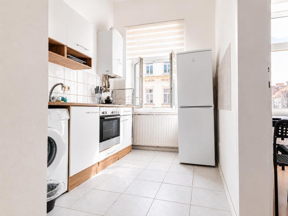 Kitchen or kitchenette, stove, toaster, washing machine