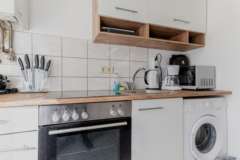 Kitchen or kitchenette, washing machine
