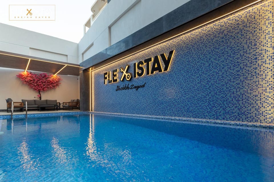 Day, Property logo or sign, Logo/Certificate/Sign, Pool view, Swimming pool, sunbed