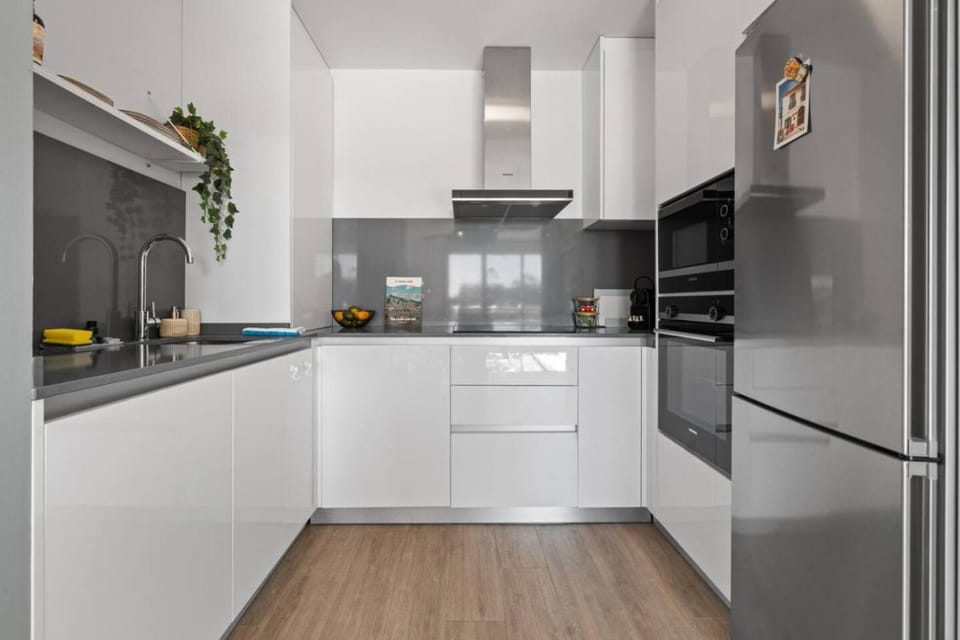 Kitchen or kitchenette, dishwasher, microwave, oven, stove