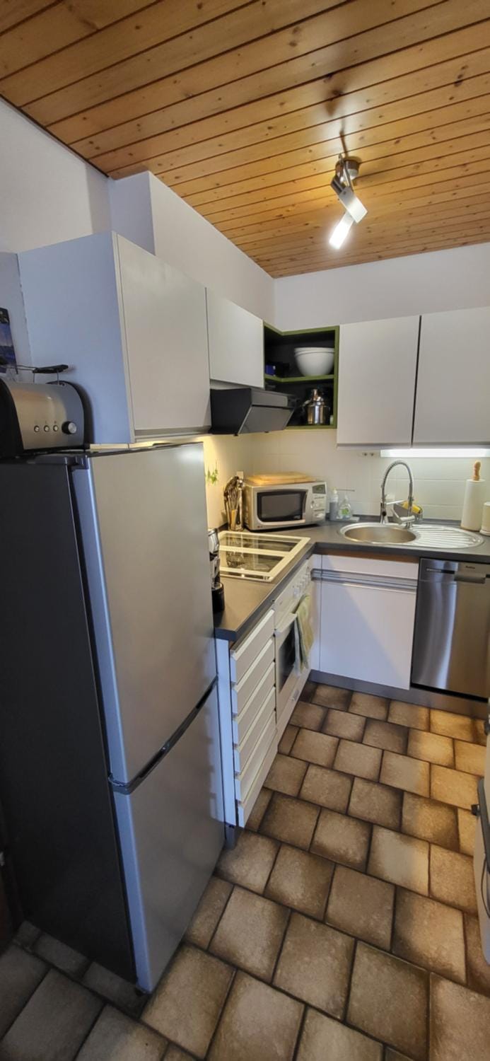 Kitchen or kitchenette, dishwasher, microwave, oven, stove, toaster