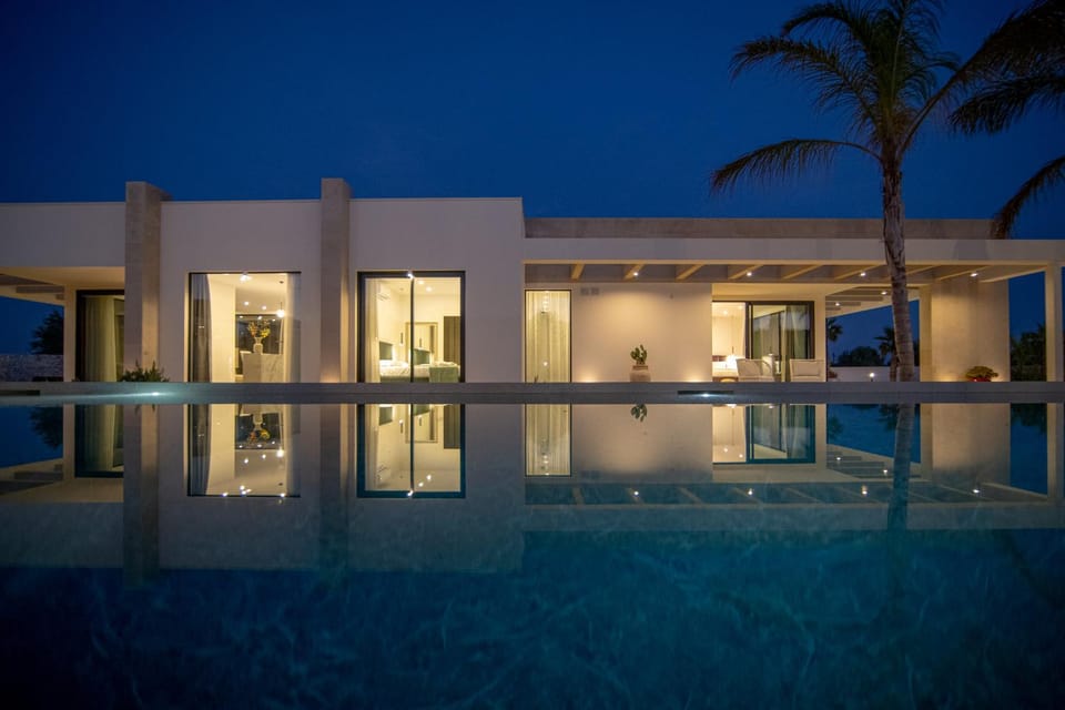 Property building, Patio, Night, Pool view, Swimming pool