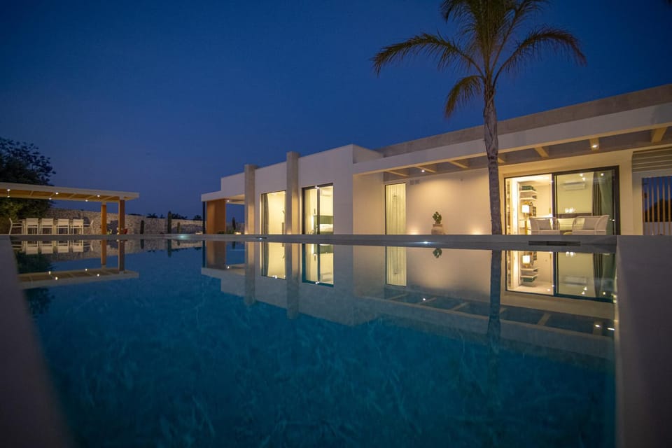 Property building, Night, Pool view, Swimming pool, sunbed