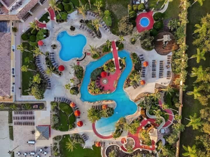 Cozy 4BR Near Disney with Shared Pool Arcade & Gym House in Four Corners